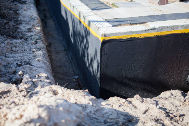 Professional Interior Drainage System technician working in Greensburg, IN